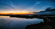 Aerial Panorama Early Sunrise Over Northern Sweden. Noctilucent Night Clouds, Summer Foggy Lake Reflects Sky