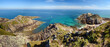 Panoramic view of the spectacular sandstone cliffs of Cape Erquy and the emerald sea.