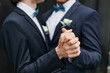 © Seventyfour - Close up of two men dancing together during wedding ceremony, same sex marriage