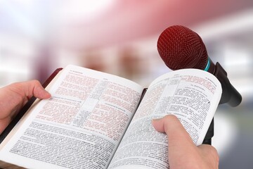 Poster - Pastor with a Bible in hand during a sermon. The preacher delivers a speech