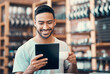© C Haas/peopleimages.com - Happy, relaxed and carefree man reading social media news on a tablet while enjoying coffee. Young casual guy replying to emails, browsing the internet or subscribing to online dating app at a cafe