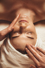 Wall Mural - close-up of young woman getting spa massage treatment at beauty spa salon. spa beauty treatment conc