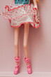 close up detail of  the legs of an anorexic doll