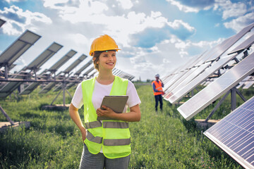 young female ecological engineer uses digital tablet she collected efficient information about solar