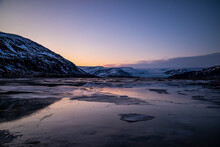 Mountain Lake In Winter Under Sunset Sky