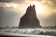 Volcanic Beach And Basalt Sea Stacks Washed By Waves