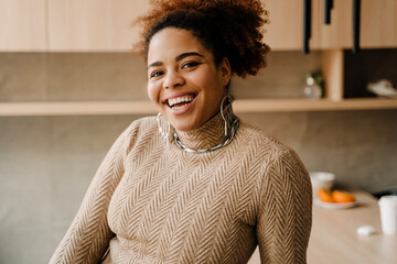 Young beautiful smiling african woman looking at camera