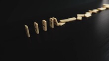The Fall Of Small Dominoes On A Black Background. One Event Triggers Other Events. The Domino Principle