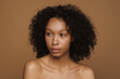 © Drobot Dean - Black shirtless woman posing and looking aside