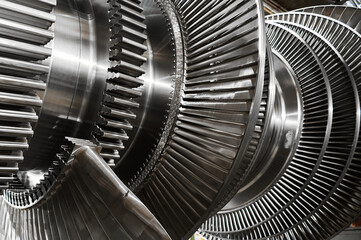 shiny blades of high-speed steam turbine in workshop