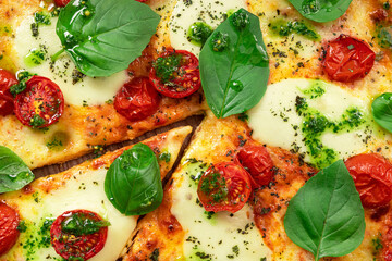 Wall Mural - Italian pizza Margherita with basil leaves, fresh tomato and mozzarella cheese.