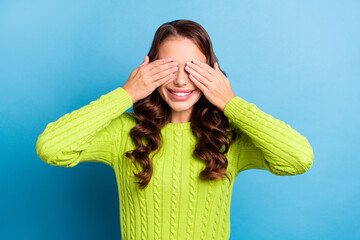 Sticker - Photo of cute young woman wavy hairstyle hands cover eyes surprise dressed stylish green knitwear sweater isolated on blue color background