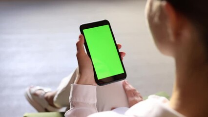 Close up view of girl looking at empty phone screen. People making online purchase, booking hotel, choosing goods and services. New app, ai concept