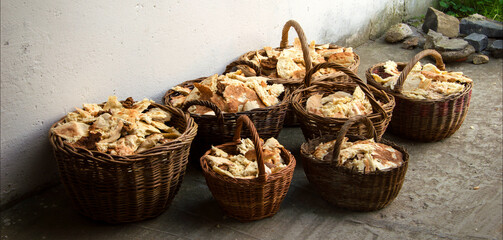 Wall Mural - Pieces of five loaves in seven baskets. Biblical miracle