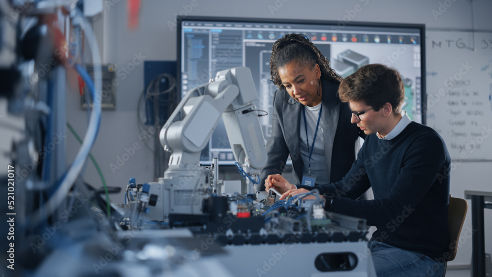 Male Student Engineer Discussing Ideas with Black Teacher while Working ...