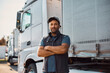 Portrait of professional truck driver looking at camera.