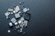 Top view of various electronic components on black background.