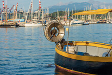 Small Yellow And Black Fishing Boat With A Winch For Fishing With Nets, Moored In The Port Of La Spezia Town, Gulf Of La Spezia, Mediterranean Sea, Liguria, Italy, Europe.