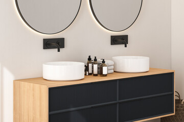 Close up of modern bathroom cabinet with white wall, double sink standing on wooden countertop and two round mirrors. 3d rendering