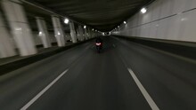 Fast BMW Motorcycle Rides Through City Tunnel In The Night, Fpv Drone Shot