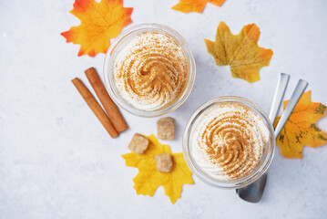 Wall Mural - Pumpkin spiced Latte Coffee with whipped cream in a glass