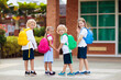 © famveldman - Child going back to school. Start of new school year after summer vacation. Little girl with backpack and books on first school day. Beginning of class. Education for kindergarten and preschool kids.