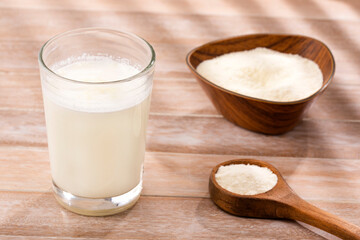 Wall Mural - Glass of fresh liquid and powdered milk