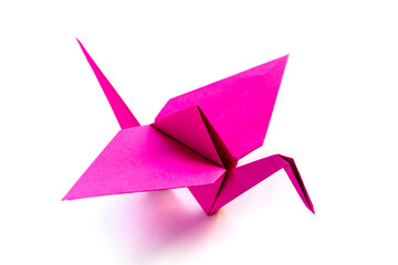 Wall Mural - pink paper crane origami isolated on a white background