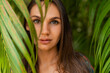 © Svetlana Sokolova - Close Graceful Woman model in  red  swim wear with long straight hair posing   in tropical nature.