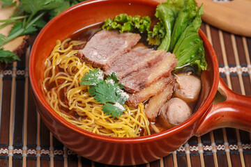 Poster - Braised beef egg noodles with meatballs. Popular street food, Thai food.