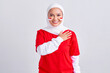 © Bangun Stock Photo - Happy young Asian muslim woman in red white t-shirt greeting to celebrating indonesian independence day on 17 august isolated on white background