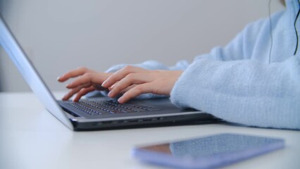 Programmer coding on laptop. Woman typing text on notebook keyboard 