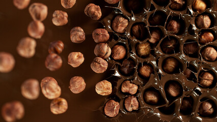 Canvas Print - Freeze motion of falling hazelnuts into melted chocolate.