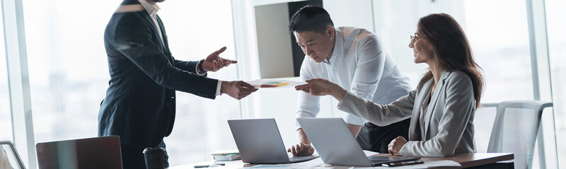 Wall Mural - Creative business team working on project in office with panoramic view. The concept of teamwork.