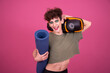 Leinwandbild Motiv Fitness and healthy lifestyle. Sporty funny drag queen. Pink background.	