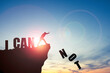 © Dilok - Silhouette man pushing Not wording from cliff for change I can not to I can , Positive thinking mindset concept.