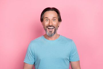 Sticker - Photo of handsome cheerful mature man see huge sales promo on black friday isolated on pink color background