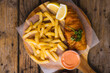 Directly above shot of french fries with seafood and sauce on serving board, copy space