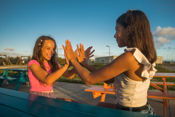 Wall Mural - Happy positive girl play with her bestie at the clapping hands