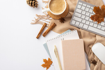 Autumn business concept. Top view photo of keyboard computer mouse cup of coffee on rattan placemat reminders cinnamon sticks yellow maple leaves pine cone anise and plaid on isolated white background