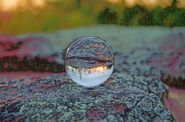 Poster - Shenandoah national park Sunset is reflected in a Crystal Ball, resting on a flat rock. 