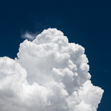 Billowing Cloud Over Navy Sky