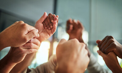 Wall Mural - Diverse people holding hands in teamwork, success and support while showing solidarity, trust and unity in office. Closeup of business team, men and women standing together for equal workplace rights