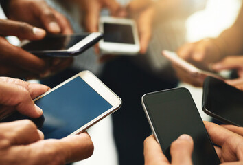 Aufkleber - Closeup of business people hands typing on a phone, texting on social media or reading emails or online news. Diverse group of colleagues social networking, looking at copyspace mobile screens.