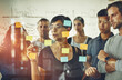 © Cecilie Skjold Wackerhausen/peopleimages.com - Business people planning ideas on a glass board thinking, brainstorming and working on strategy for a project. Smart, busy and organized workers doing work schedule brainstorm with sticky notes