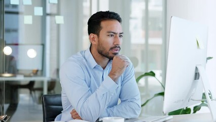 Wall Mural - Stress, anxiety and worried business man working on a computer in an office, looking nervous and upset. Young professional sending an email after missing a deadline. Guy trying to fix problem online