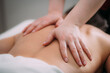 © Microgen - Back massage in a massage salon, woman having a relaxing back massage.