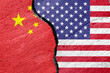 Flags of China and the United States of America on a cement plaster of a cracked wall as a concept of escalation and tension in relations