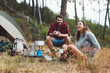 © Jacob Lund - Young couple having a good time while camping