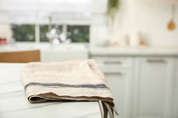 Sticker - Clean towel on white marble table in kitchen. Space for text